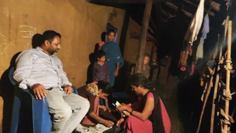 Night-time home visit health check in a village