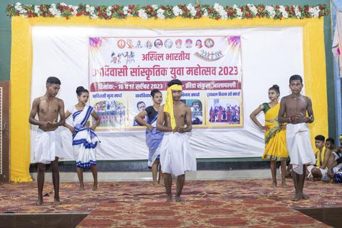 Performers in traditional dress on stage