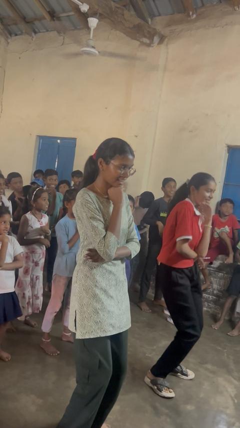 Girls dancing in a classroom at summer camp